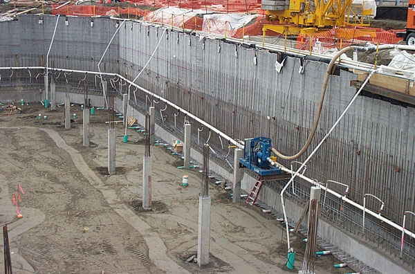 construction excavation with deep pumping wells, vacuum well points, and permanent drainage